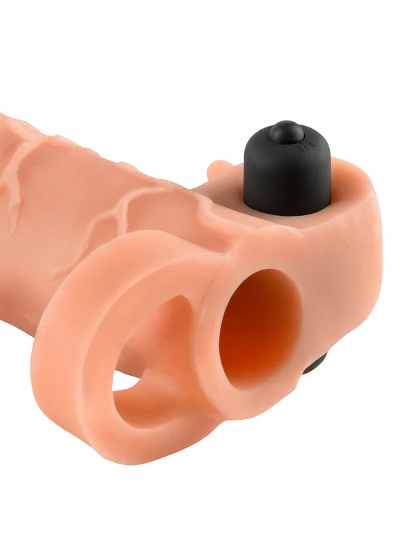 The Real Feel 1-inch vibrating penis extender includes a strap that goes around the testicles.