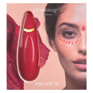 Womanizer Premium rouge et or stimulateur pour clitoris. Le Womanizer Premium, est la combinaison idéale des nouvelles technologies et du design de haute qualité. La technologie Pleasure Air stimule votre clitoris sans entrer en contact  de super doux à super puissance en 12 niveaux d'intensité différents.